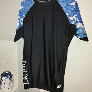 Black Rash Guard Swim Top with Blue Wave Sleeves